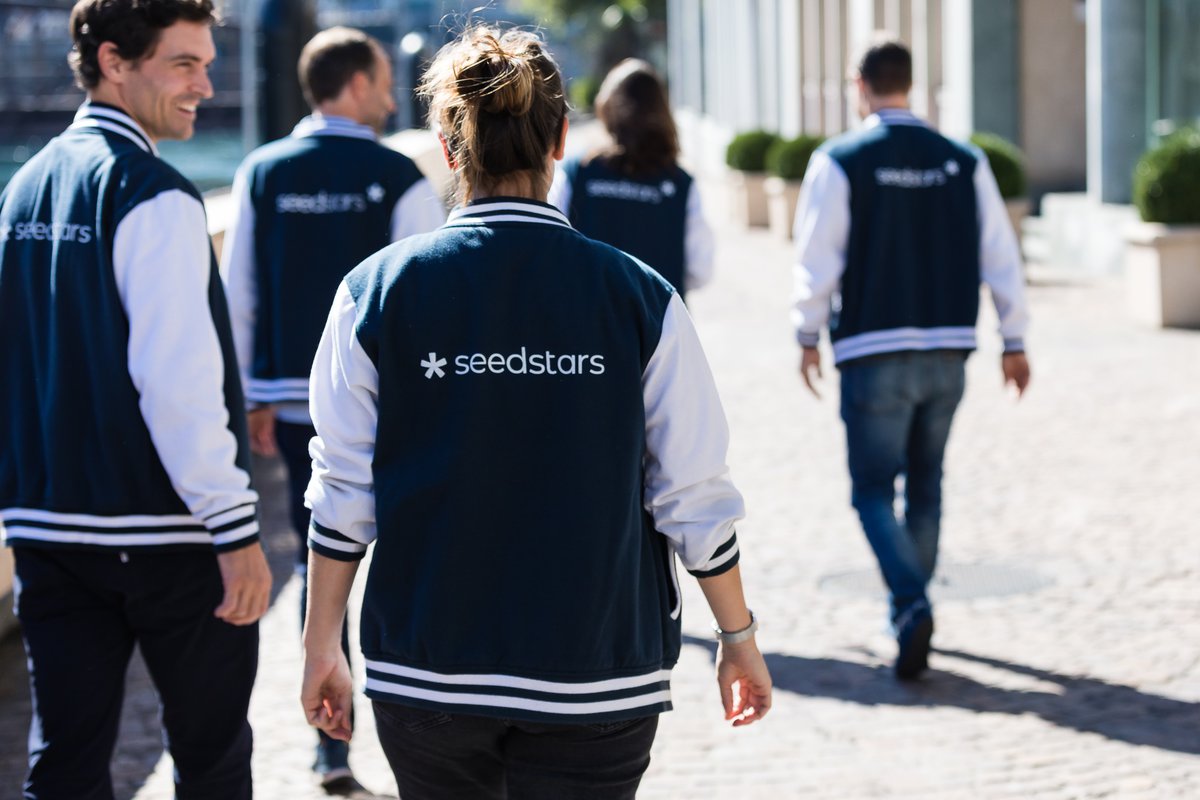 Members of the Seedstars team in branded jackets